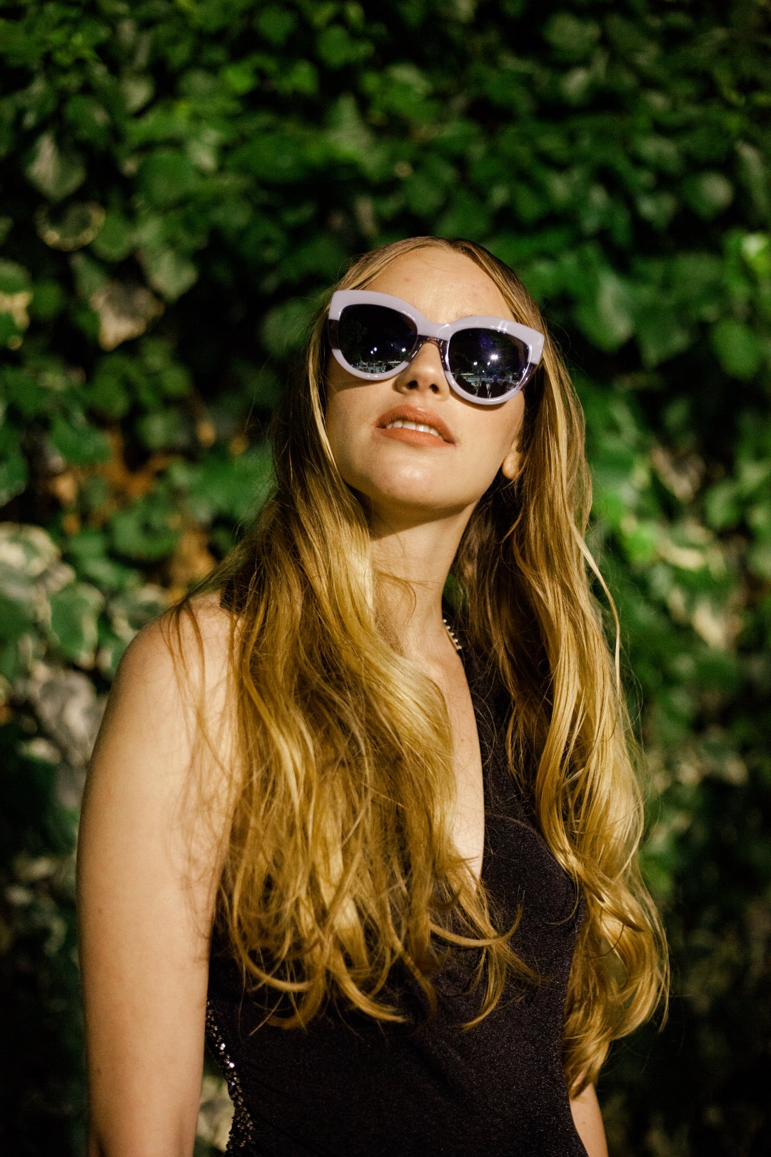Relaxed beach waves and sunglasses in bright Cyprus daylight, effortless summer styling. Beach hair at HAIR ETC. STUDIO Nicosia Cyprus
