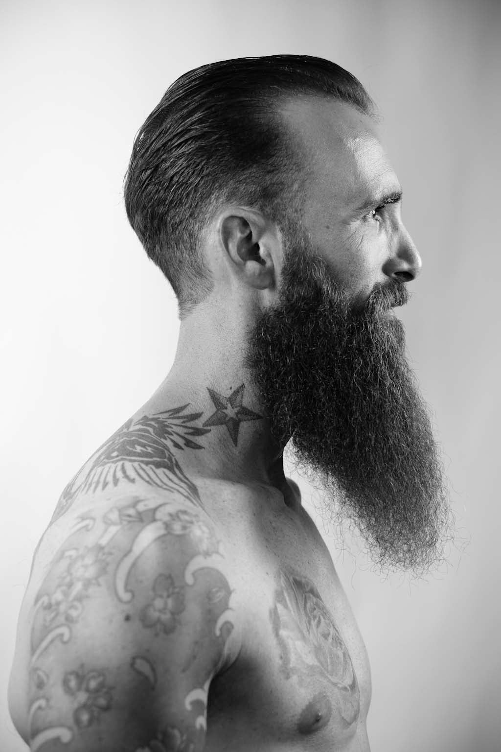 Epic long beard with slicked back undercut profile view — Of Beards And Men editorial HAIR ETC. STUDIO Nicosia