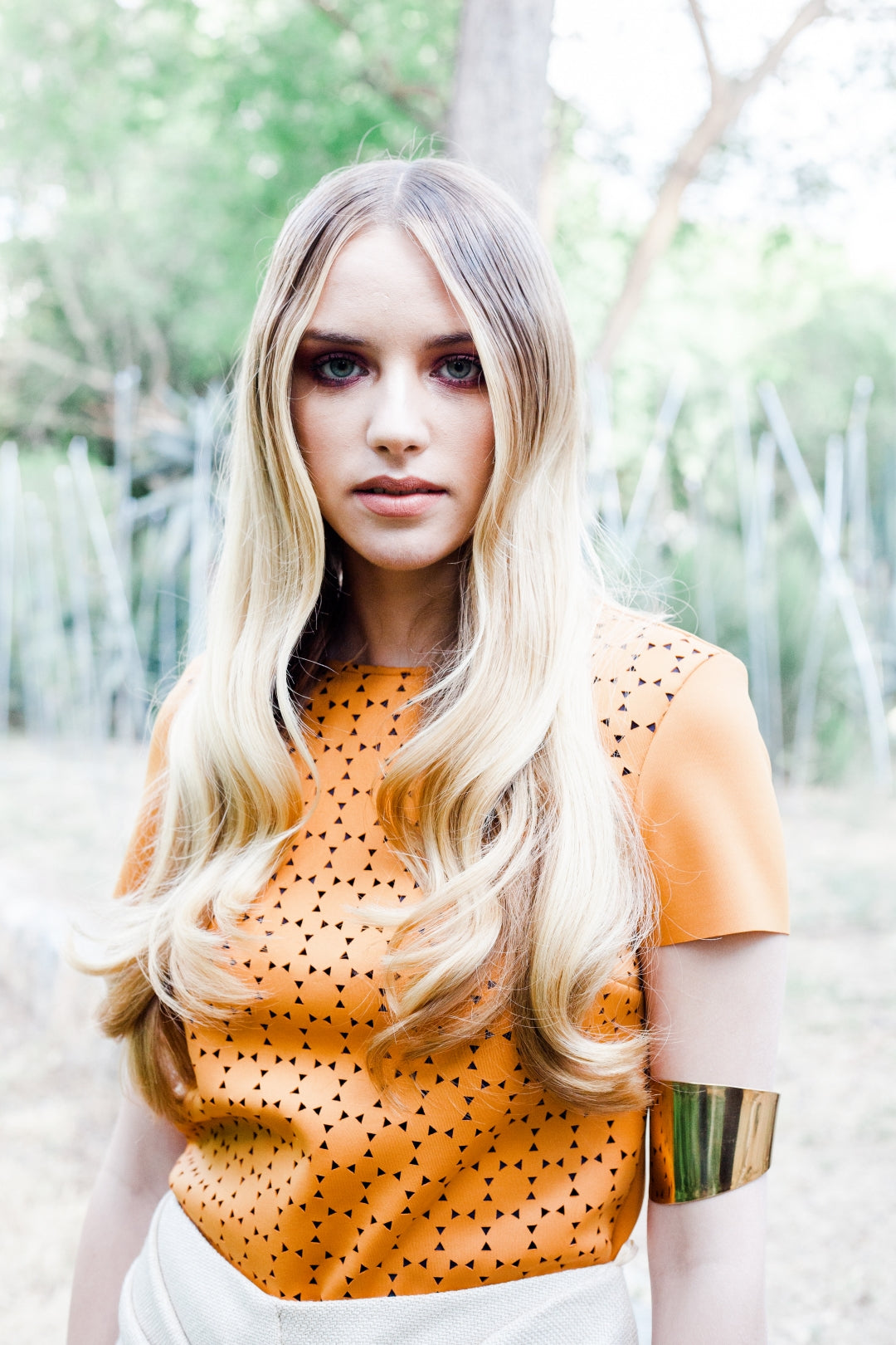 Long voluminous blonde summer waves in warm Cyprus garden light, healthy sun-ready hair. Summer hair care at HAIR ETC. STUDIO Nicosia Cyprus
